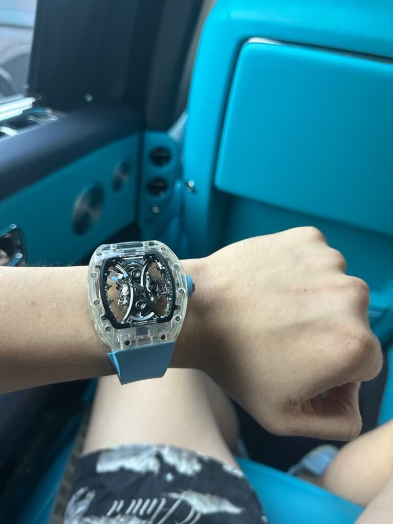 Richard Mille sapphire-case watch with light blue strap, photographed for Exclusive Masterpiece